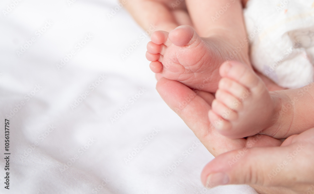 Soft, miniature feet rest comfortably on loving hands, capturing the delicate bond between parent and child in a tranquil and intimate atmosphere, embodying love and warmth. Soft, miniature feet rest comfortably on loving hands, capturing the delicate bond between parent and child in a tranquil and intimate atmosphere, embodying love and warmth.
