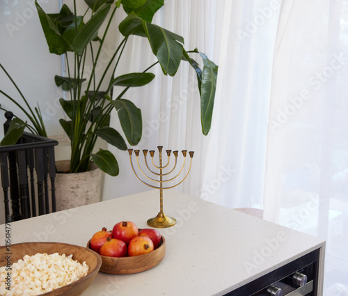 Table with a gold menorah, multibranched candelabra, used in the religious rituals of Judaism