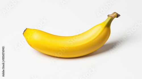 Single yellow banana on white background