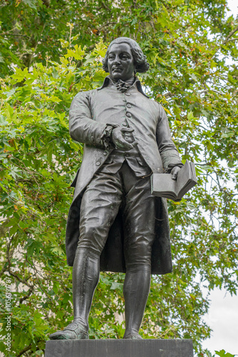 Statue in honor of Robert Raikes in Victoria Embankment garden in central London.UK.