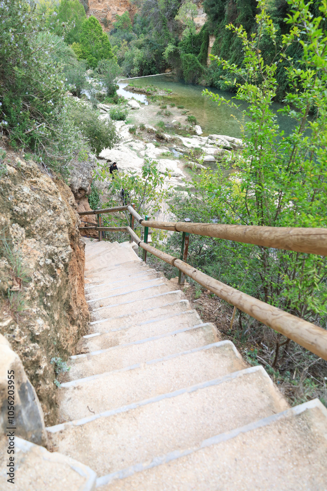 Fototapeta premium Stairs of The Gorgo de la Escalera waterfall in Anna town