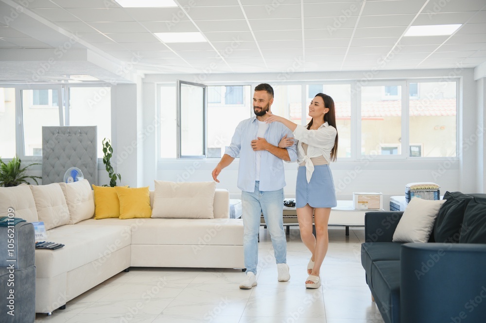 Woman with her husband at the furniture store showroom Woman with her husband at the furniture store showroom