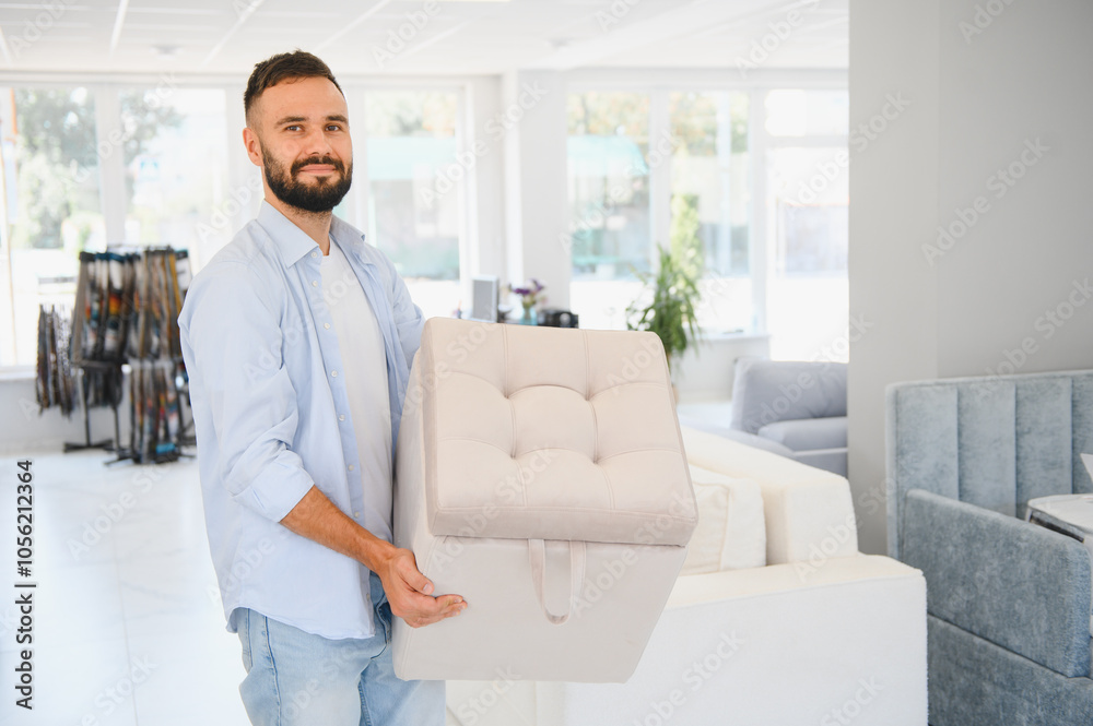 Male buyer in a furniture center chooses new modern chairs for her home Male buyer in a furniture center chooses new modern chairs for her home