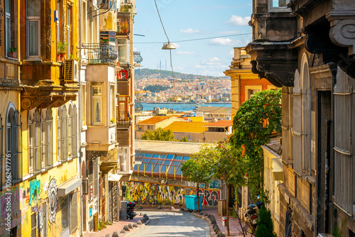 Canvastavla View of the Bosphorus Strait and Asian side of the city at the Golden Horn, from a hillside street of shops in the Beyoğlu district of Istanbul, Turkey
