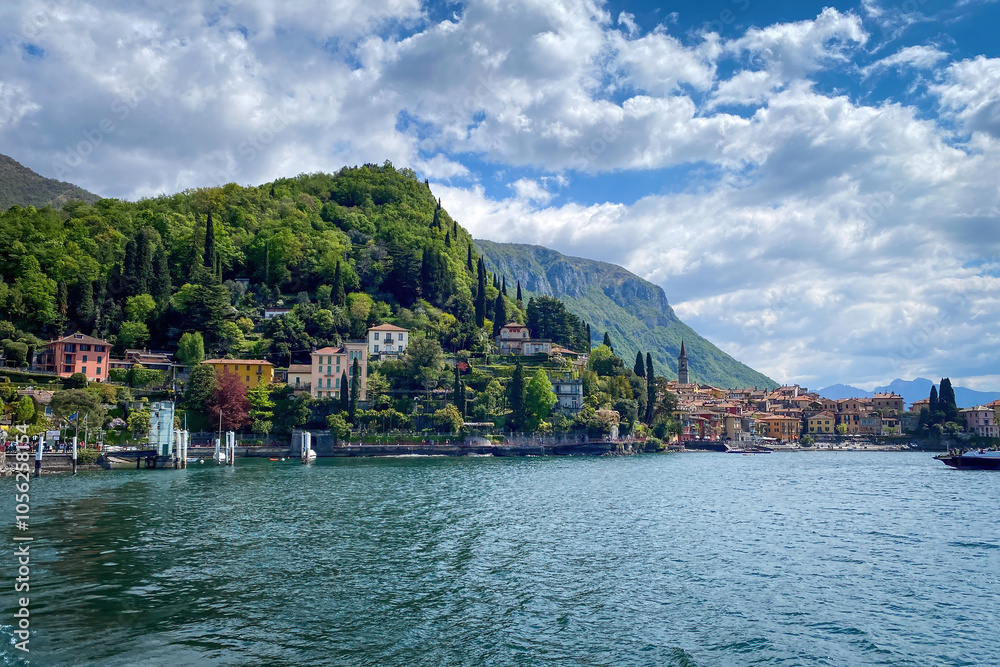 Scenic view of beautiful colorful town of Varenna on the eastern shore of Lake Como, Italy seen from water