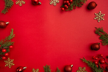 Christmas and Happy New year background with gold glitter decorations on red bright background. Holiday party decoration . Christmas celebration, holiday card