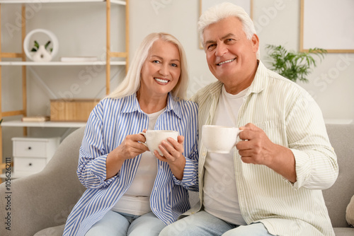 Happy senior couple with cu...