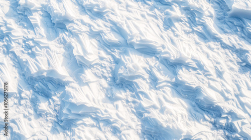 An overhead view of a smooth white snow surface on a sunny winter day