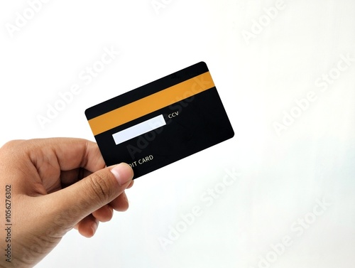 Hand Holding Black Credit Card isolated on white background 
