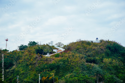 Kaohsiung, Taiwan, Republic of China, 01 25 2024: The landscape of Kaosiung port harbor, downtown, shiziwan (siziwan, xiziwan), and shoushan mountain seen from Qijin lighthouse photo