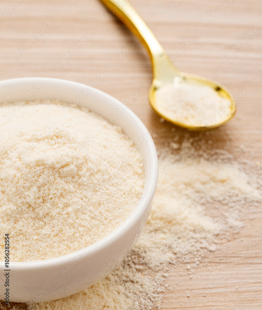 Hydrolyzed collagen powder in bowl and spoon - Organic gelatin powder Hydrolyzed collagen powder in bowl and spoon - Organic gelatin powder