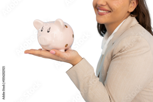 Creative Latina entrepreneur with a piggy bank