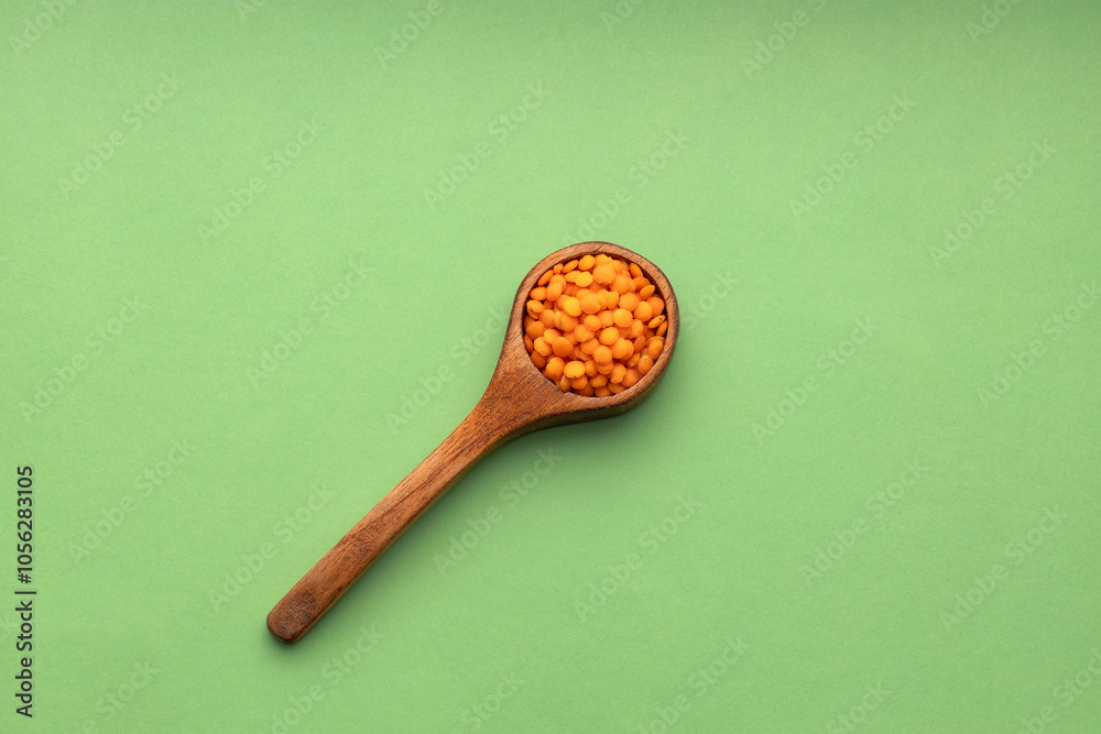 Organic red lentils on the spoon - Lens culinaris. Organic red lentils on the spoon - Lens culinaris.