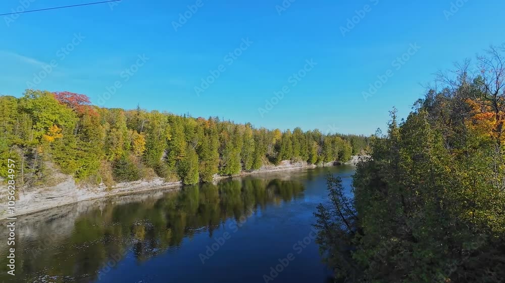 View at south of Trent River falls from Ranney Gorge Suspension Bridge in Campbellford town. Trent River in southeastern Ontario flows from Rice Lake into the Bay of Quinte on Lake Ontario. View at south of Trent River falls from Ranney Gorge Suspension Bridge in Campbellford town. Trent River in southeastern Ontario flows from Rice Lake into the Bay of Quinte on Lake Ontario.