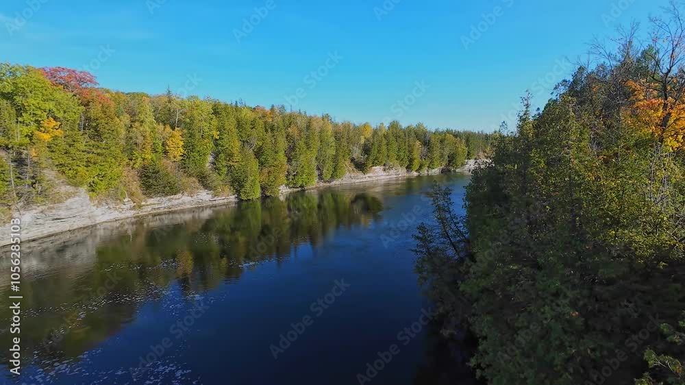 View at south of Trent River falls from Ranney Gorge Suspension Bridge in Campbellford town. Trent River in southeastern Ontario flows from Rice Lake into the Bay of Quinte on Lake Ontario. View at south of Trent River falls from Ranney Gorge Suspension Bridge in Campbellford town. Trent River in southeastern Ontario flows from Rice Lake into the Bay of Quinte on Lake Ontario.