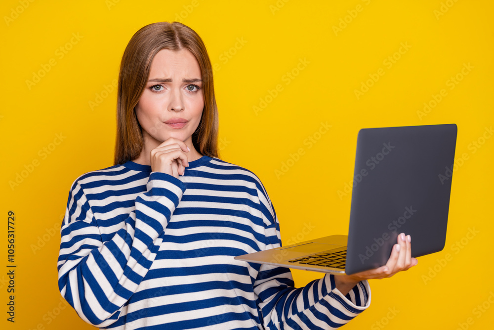 Photo of adorable cute woman wear striped stylish clothes hold gadget isolated on yellow color background Photo of adorable cute woman wear striped stylish clothes hold gadget isolated on yellow color background