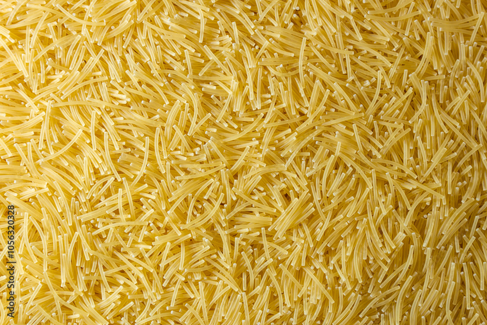 Uncooked Filini Pasta: A Culinary Canvas of Noodles, Creating a Lively and Textured Background for Gourmet Cooking. Dry Pasta. Raw Macaroni - Top View, Flat Lay Uncooked Filini Pasta: A Culinary Canvas of Noodles, Creating a Lively and Textured Background for Gourmet Cooking. Dry Pasta. Raw Macaroni - Top View, Flat Lay