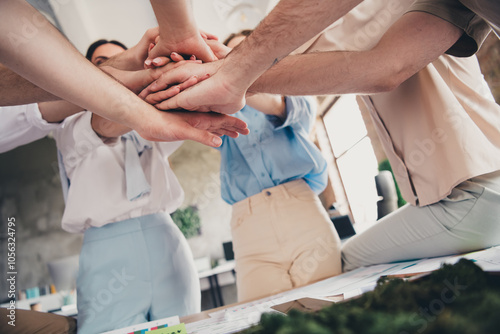 Croppe photo of group business company workers pile stack hands agreement modern loft interior office indoors photo