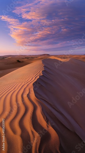 Fototapeta Naklejka Na Ścianę i Meble -  Sand dunes stretching under a colorful sunset sky in the desert