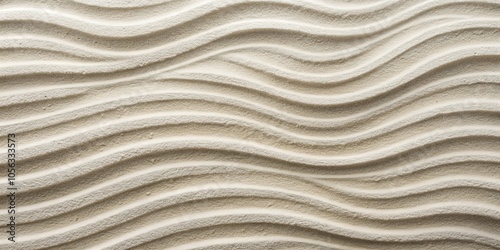 A close-up view of smooth, rippling sand with subtle variations in texture and color, reminiscent of a calming beach landscape