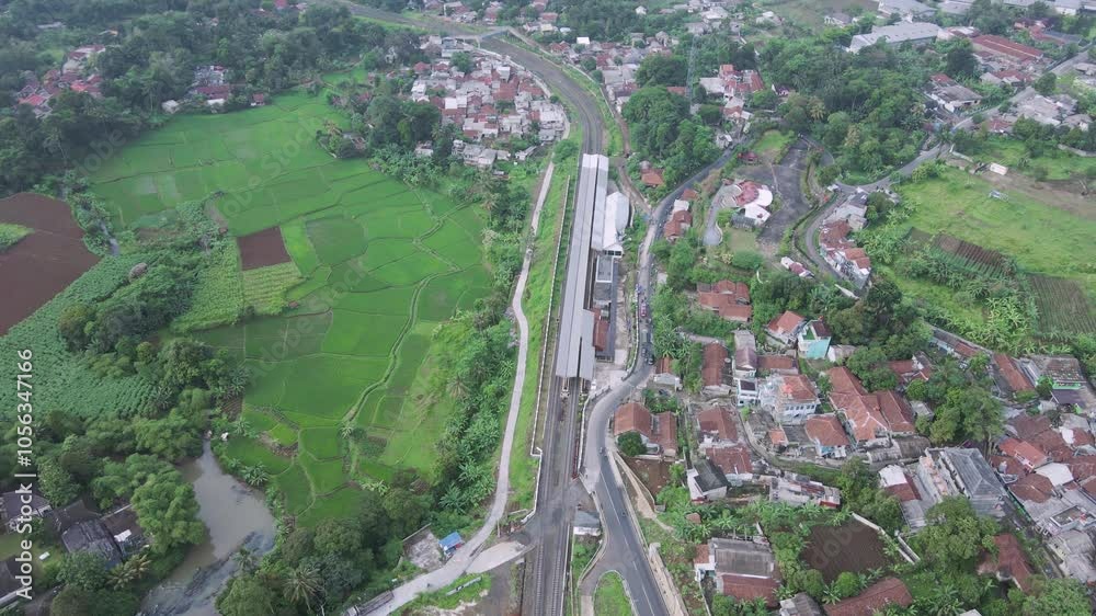 Drone video of rice fields with forests, the drone descends and the camera looks down
Drone video of rice fields with forests, the drone descends and the camera looks down