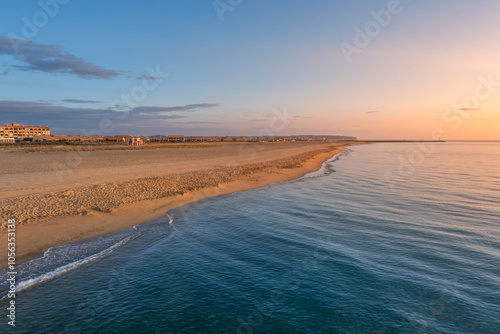 Obraz na płótnie Beach During Sunrise. Colorful Beach Sunrise, Blue Sea Water On Sunny Days. Sunrise Over The Mediterranean Sea In Beach In The Resort Town Of Leucate, Located In France. w salonie