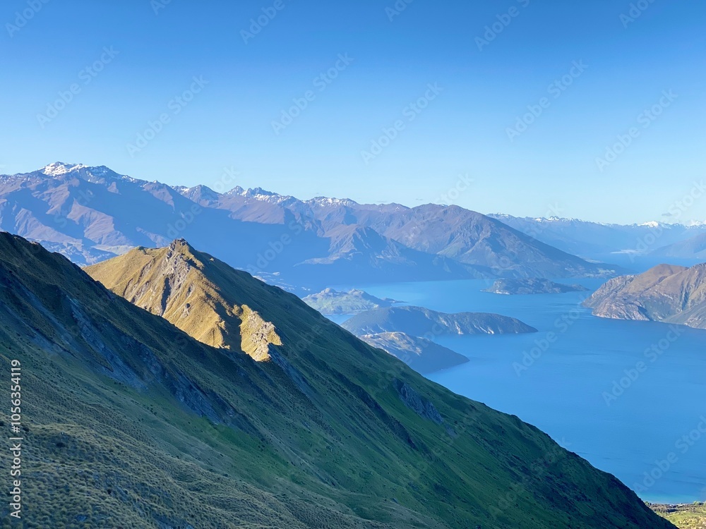 Beautiful landscapes of Lake Wanaka from Mount Roy, Roys Peak, Wanaka, South Island, New Zealand. Landscape with mountains and sky Beautiful landscapes of Lake Wanaka from Mount Roy, Roys Peak, Wanaka, South Island, New Zealand. Landscape with mountains and sky