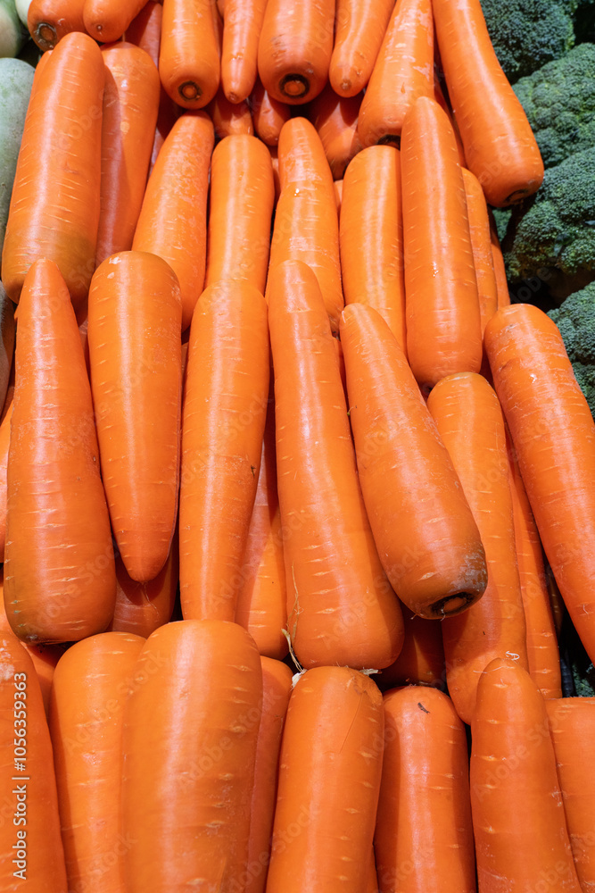 A bunch of carrots is on the shelf in Supermarket A bunch of carrots is on the shelf in Supermarket