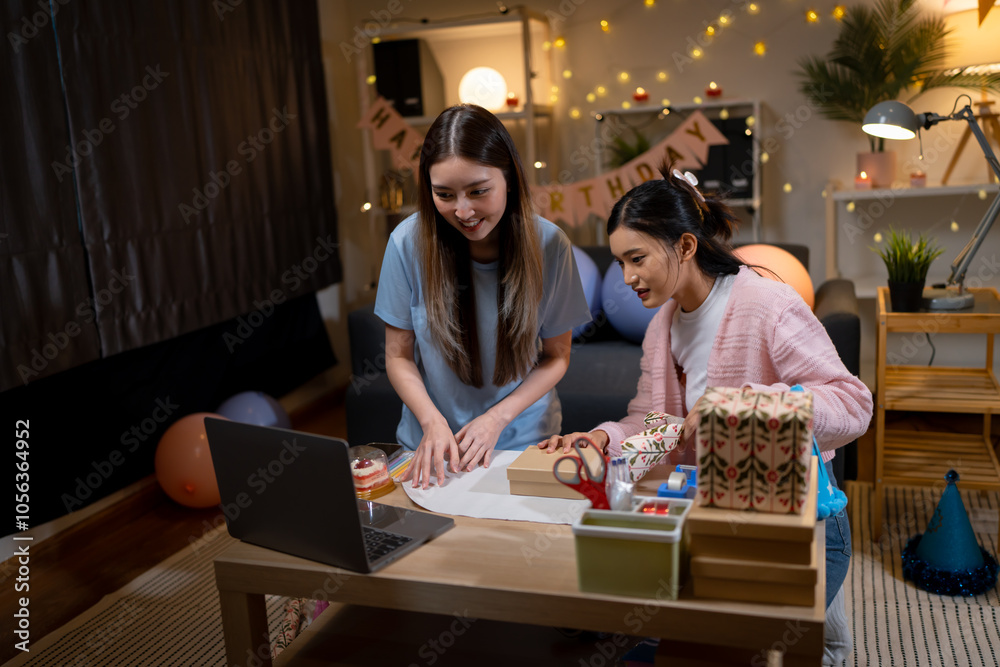 Fototapeta premium Two Asian women in room with Ciematic lighting celebrate important events such birthdays Christmas