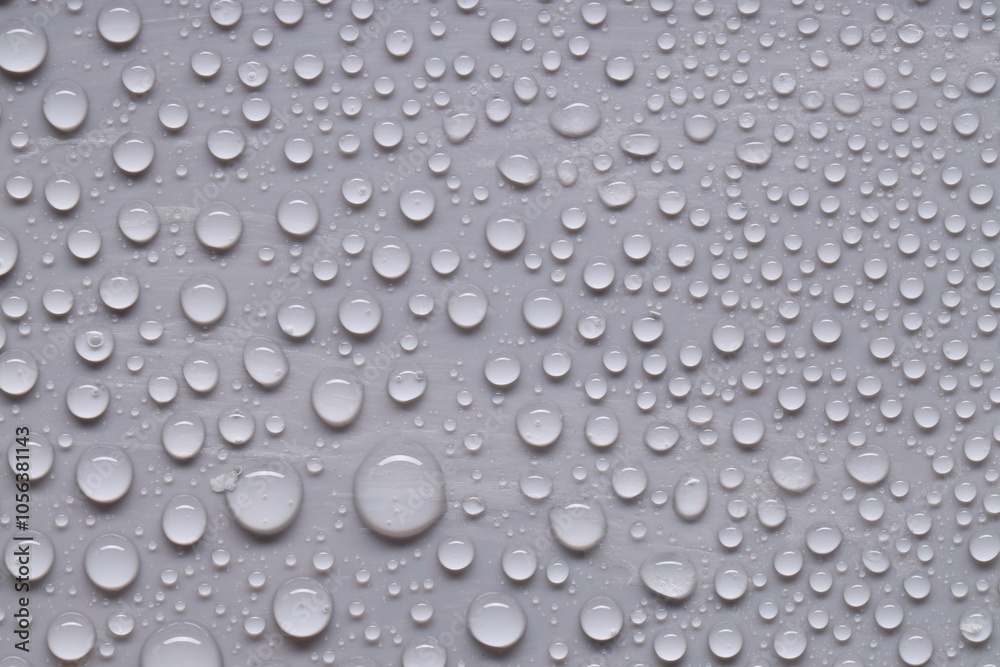 Water drops on gray background, top view Water drops on gray background, top view