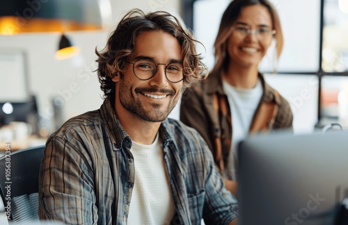 Happy Employees Collaborating on Computer in Office Environment