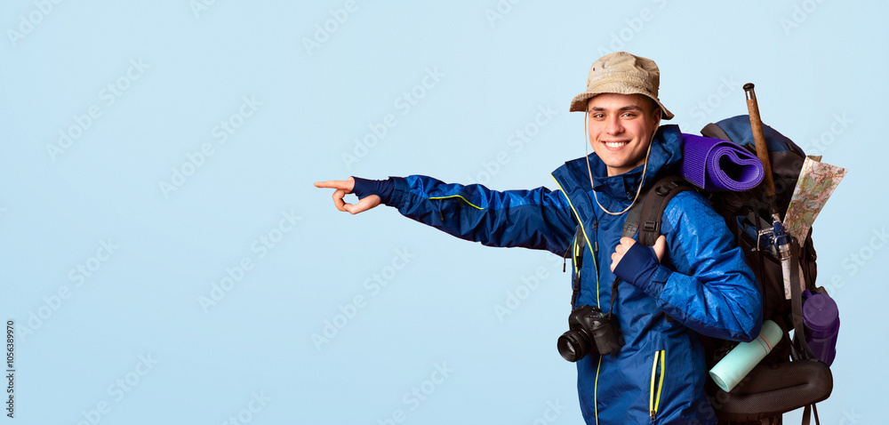 Hiking equipment shop advertising. Excited young man backpacker pointing at copy space, orange background, panorama