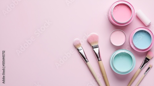 Flat lay of vibrant paint cans, brushes, and roller on a textured pastel background, plenty of space for text in the center, minimalist design