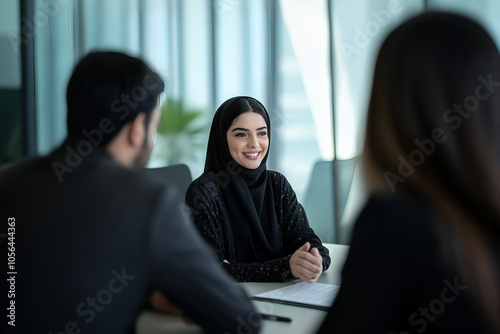 Woman in Hijab Abaya working at office meeting in room.