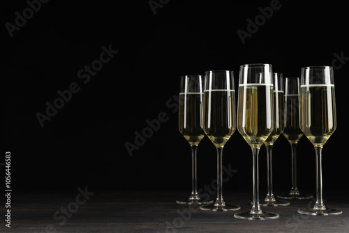 Champagne glasses on a black background