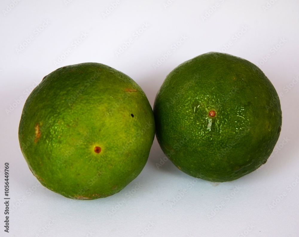 photo of fresh green lime, on white background photo of fresh green lime, on white background