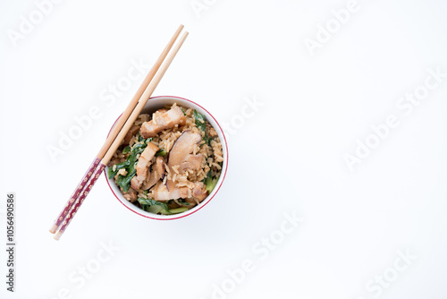 a bowl of Chinese Mustard Green Rice on white background. This bowl of mustard green rice consists of pork belly, dried prawns and mustard greens