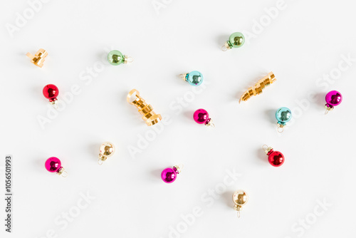 Christmas composition. Christmas colorful small balls on the white background. Flat lay top view copy space.