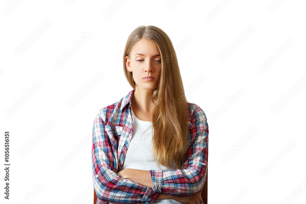 Young woman with long hair in a plaid shirt, arms crossed, isolated on white background. Concept of contemplation or dissatisfaction Young woman with long hair in a plaid shirt, arms crossed, isolated on white background. Concept of contemplation or dissatisfaction
