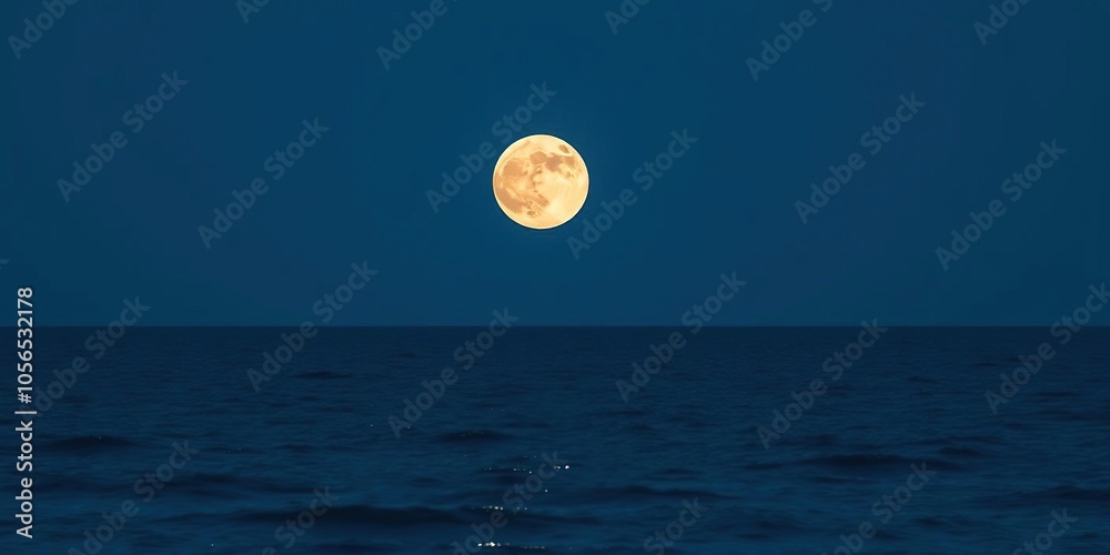Full moon rising over calm ocean at night with clear sky providing ample copy space, clear sky, tranquil scene, nature Full moon rising over calm ocean at night with clear sky providing ample copy space, clear sky, tranquil scene, nature
