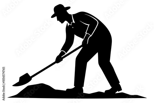 Silhouette of a man digging the ground with a shovel.