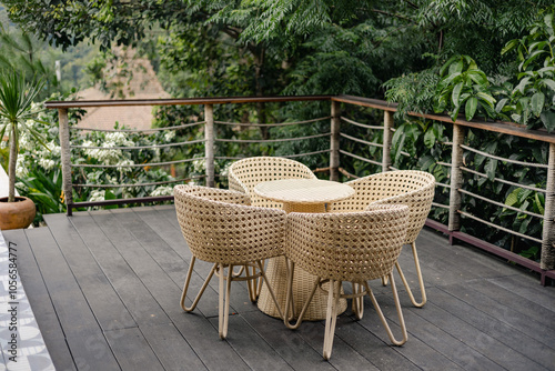 Table and rattan chairs at the balcony 