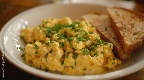 Classic scrambled eggs with a sprinkle of chives and a side of toast