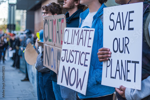 Group of Gen Z activists holding signs at a peaceful protest photo