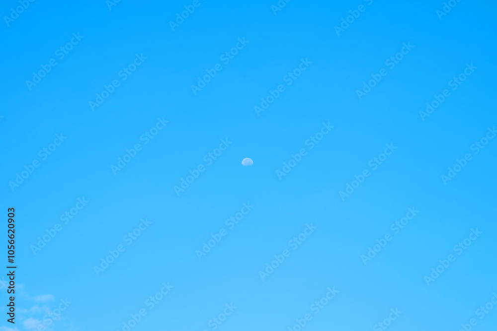 Beautiful blue clouds and a distant moon. For the background. Beautiful blue clouds and a distant moon. For the background.
