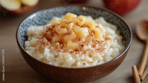 Milk rice topped with cinnamon and applesauce