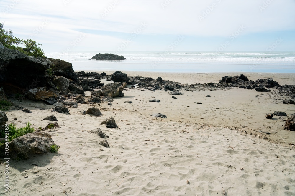 Coastal Rocks at Sumner Beach: Rugged New Zealand Shoreline