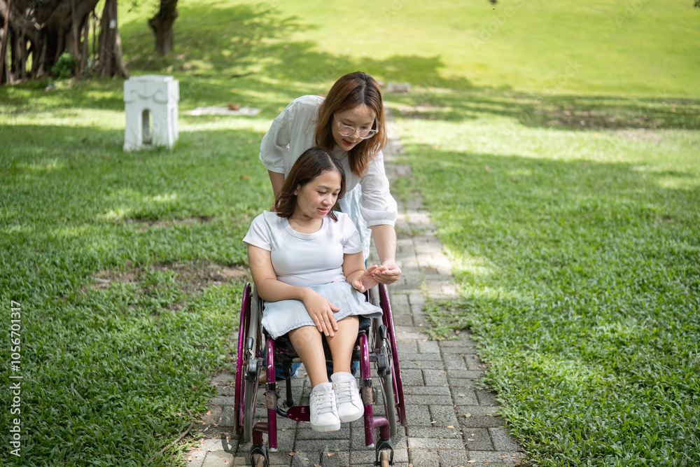 Young Disabled Woman and Best Friend Enjoying Outdoor Activities Together in a Park Setting Young Disabled Woman and Best Friend Enjoying Outdoor Activities Together in a Park Setting