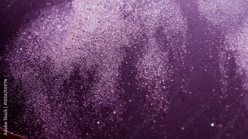 Purple abstract sandy particles flowing in slow motion. Purple abstract sandy particles flowing in slow motion.