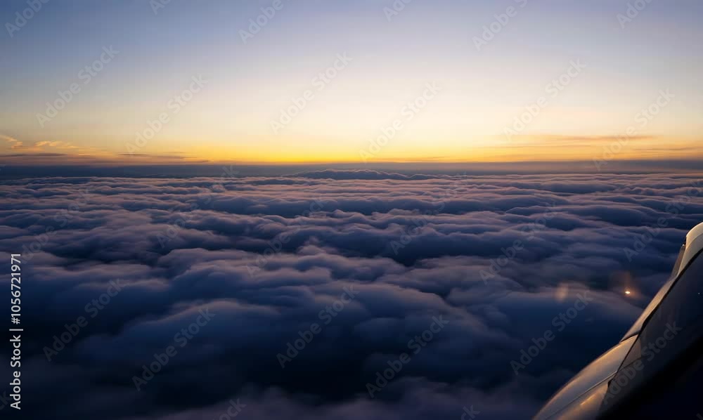 dusk flight: flying high above a sea of clouds dusk flight: flying high above a sea of clouds